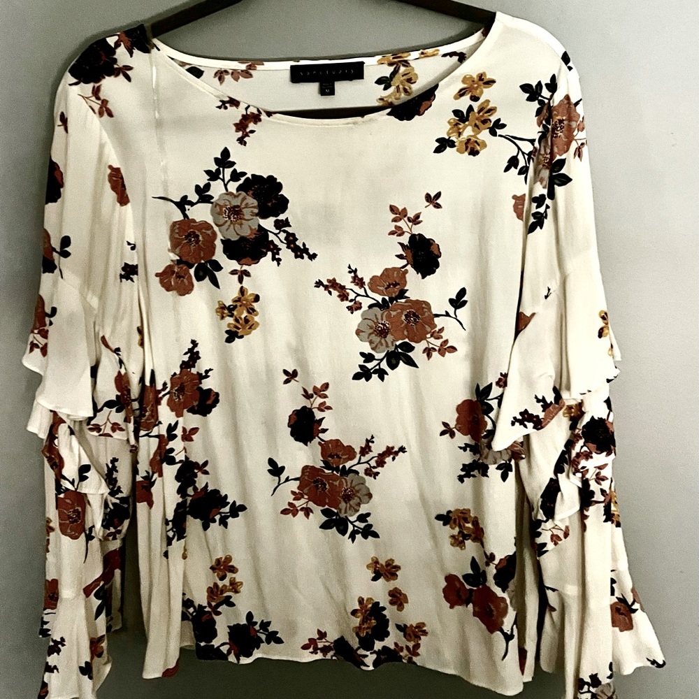 Beautiful Floral Design Blouse and Flowing Sleeves.